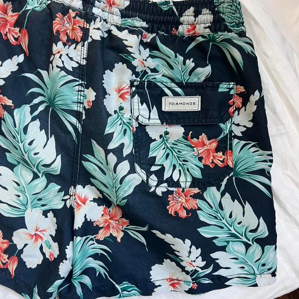 Stylish 7Diamonds men's swim trunks featuring a bold tropical print | Size L
